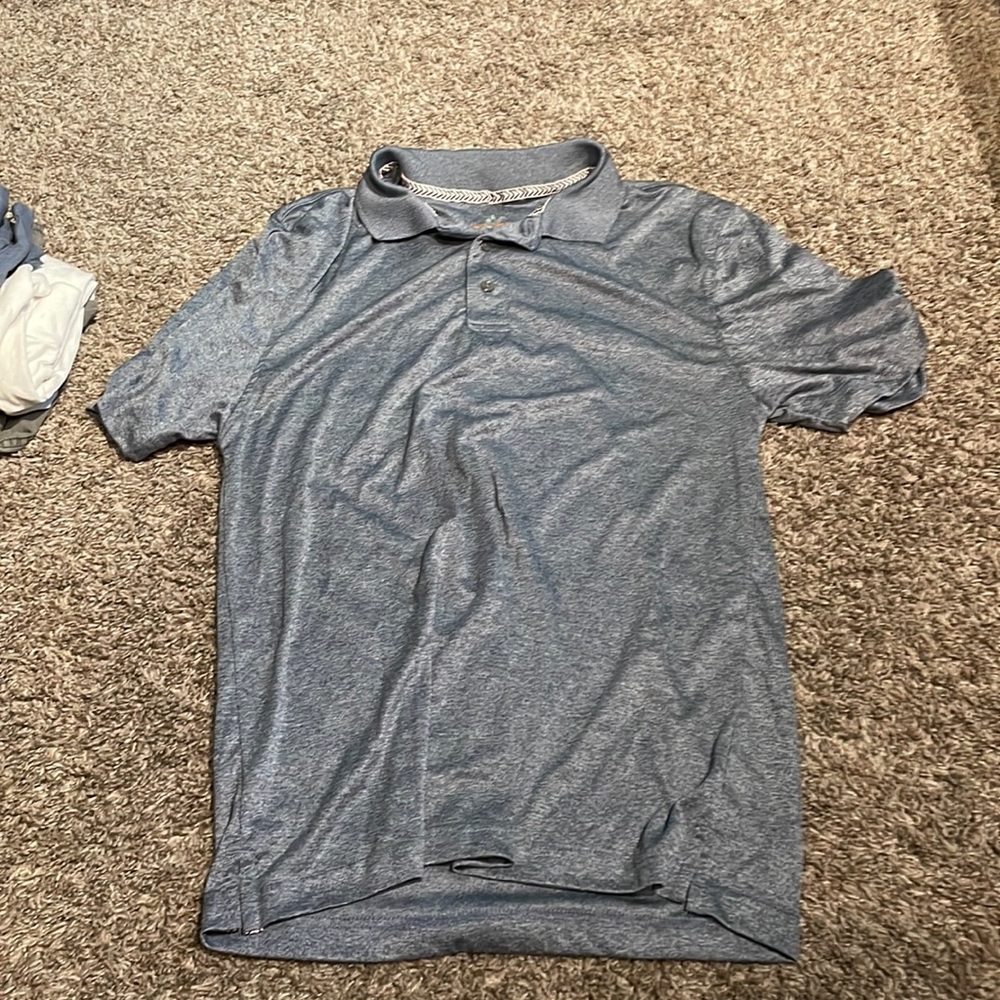 Grey-ish blue polo barley worn